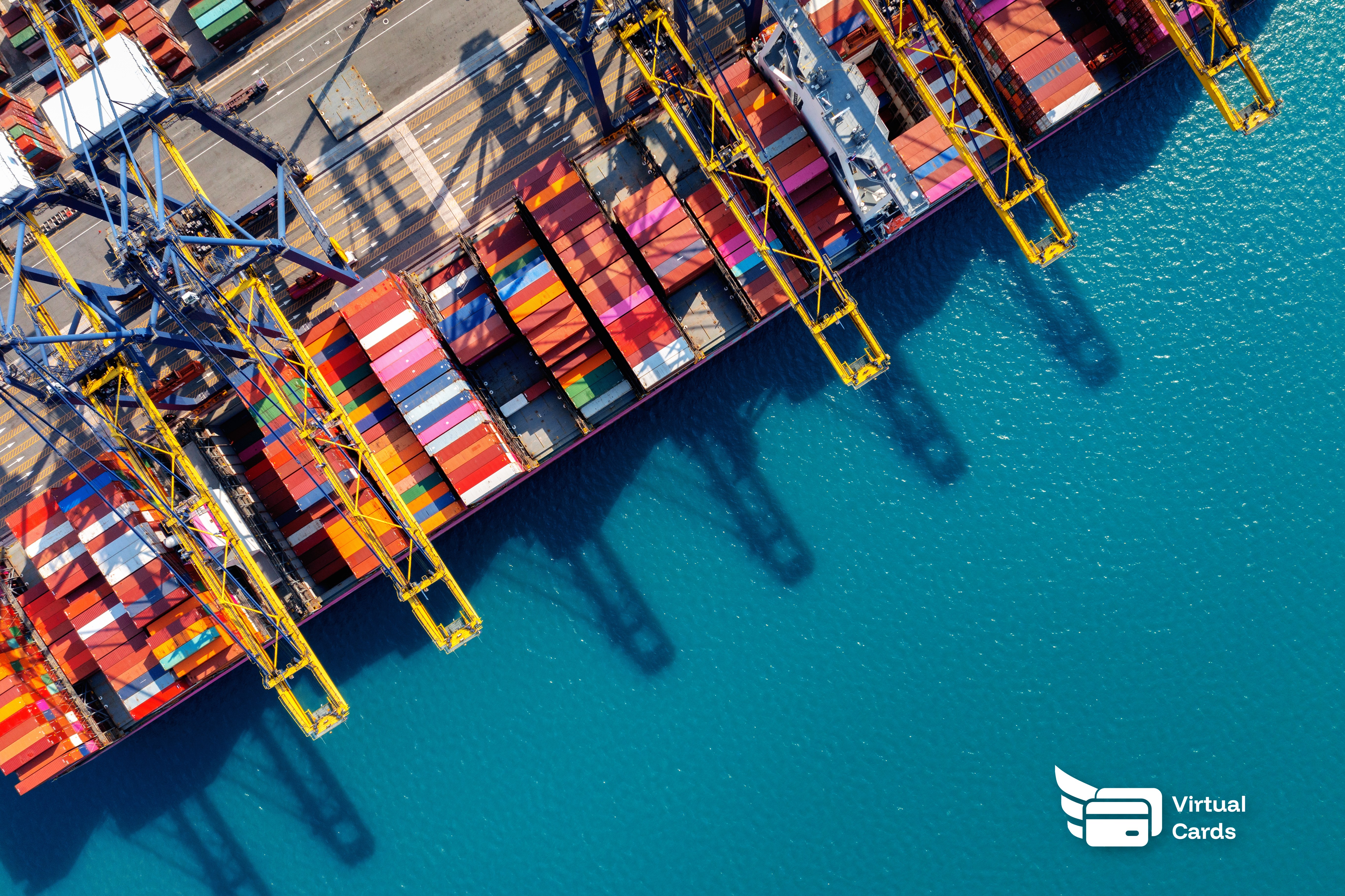 Aerial view of a cargo ship in harbor representing international trade and supplier payments.