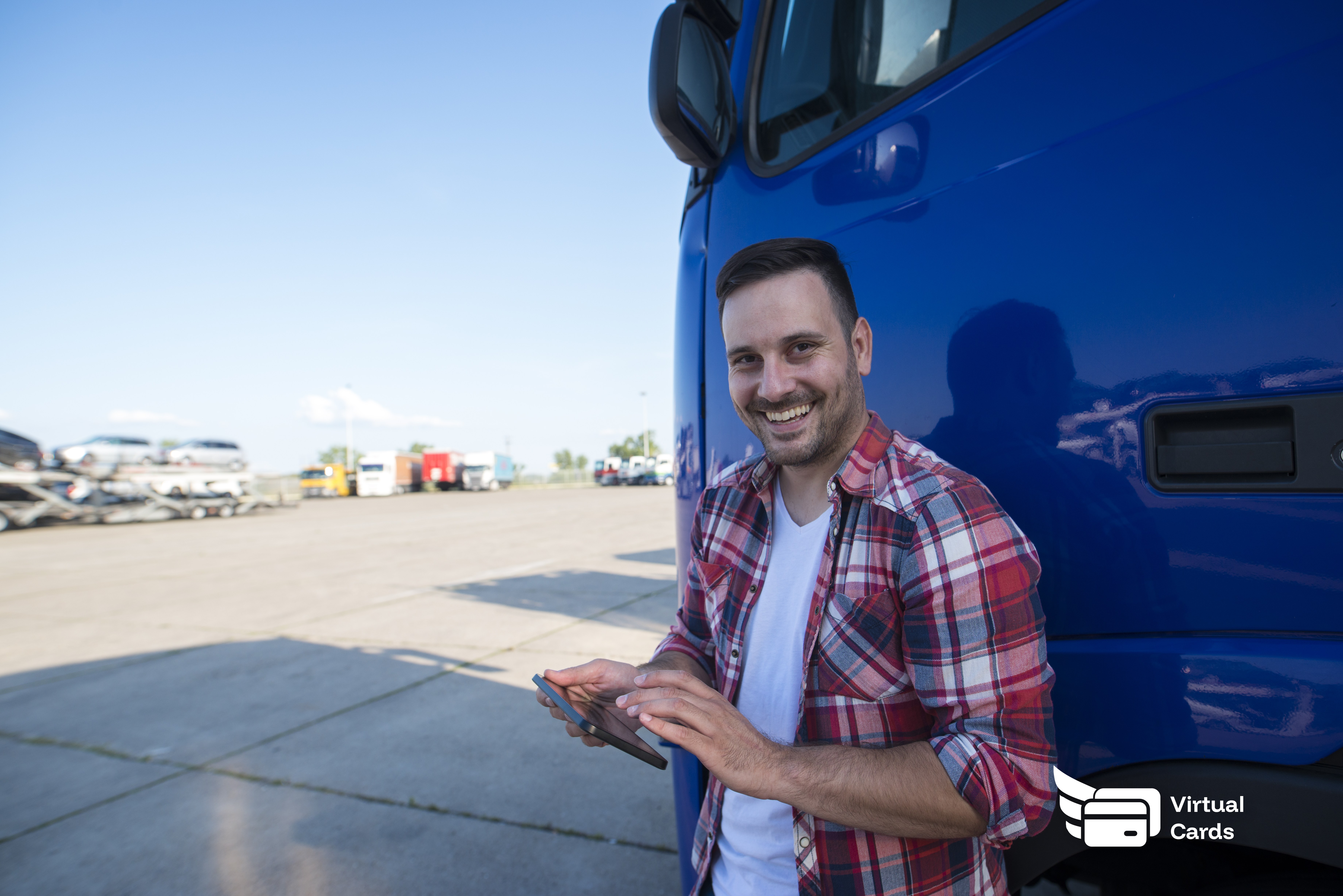Truck driver reviewing fuel expense card on a tablet at a delivery stop.