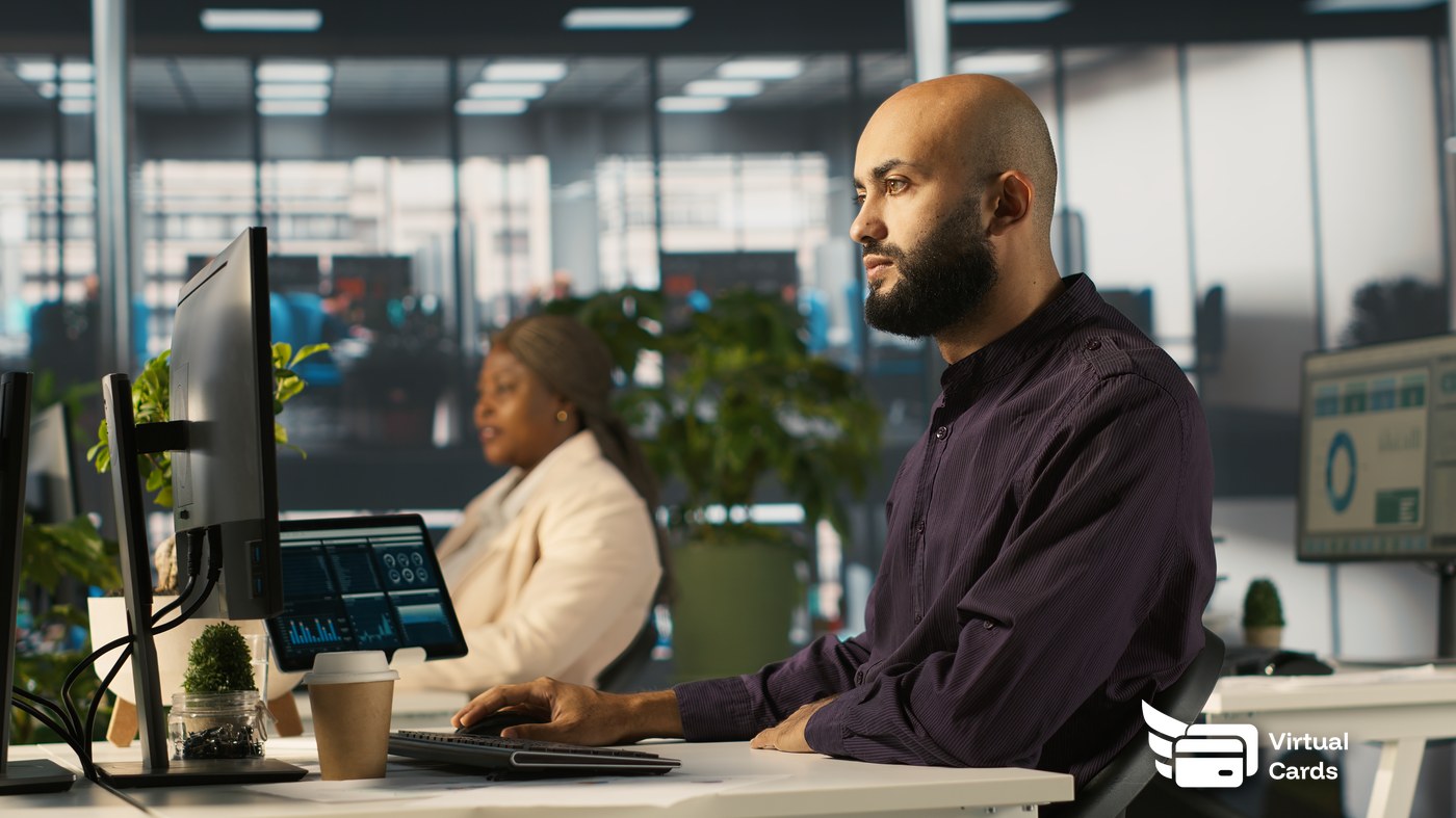 IT manager reviewing software subscription spending in a modern office dashboard.